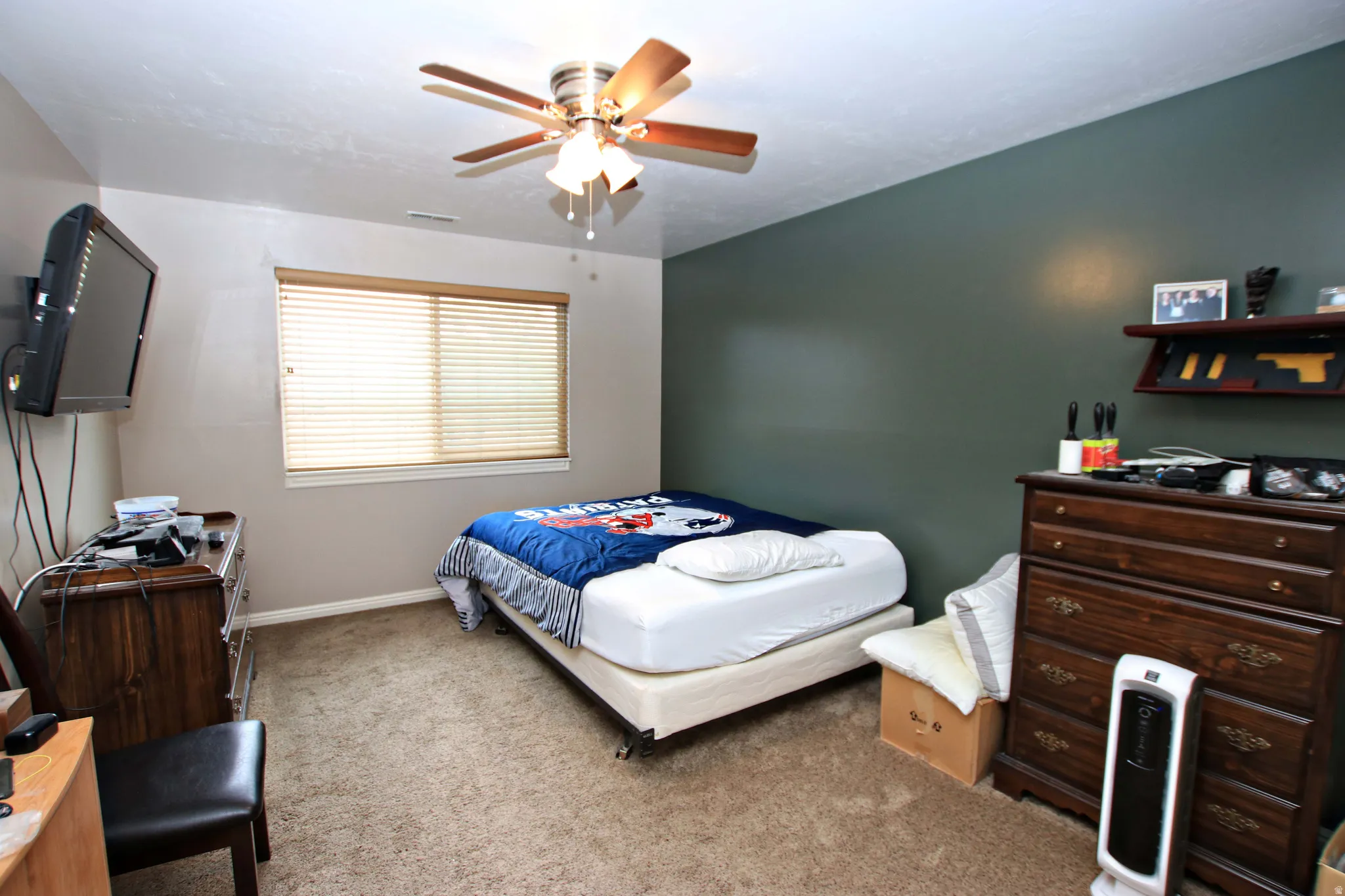 Bedroom with carpet and ceiling fan