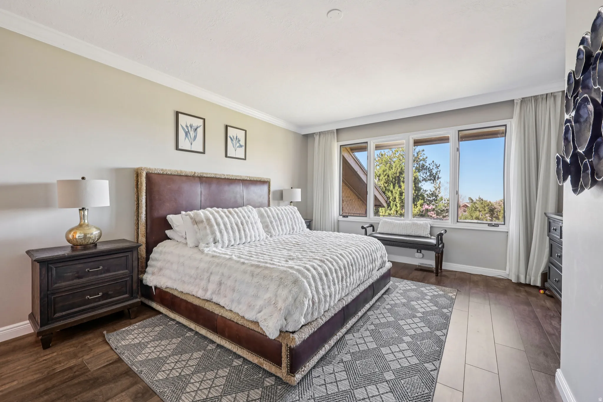 Bedroom featuring ornamental molding and dark wood-style floors