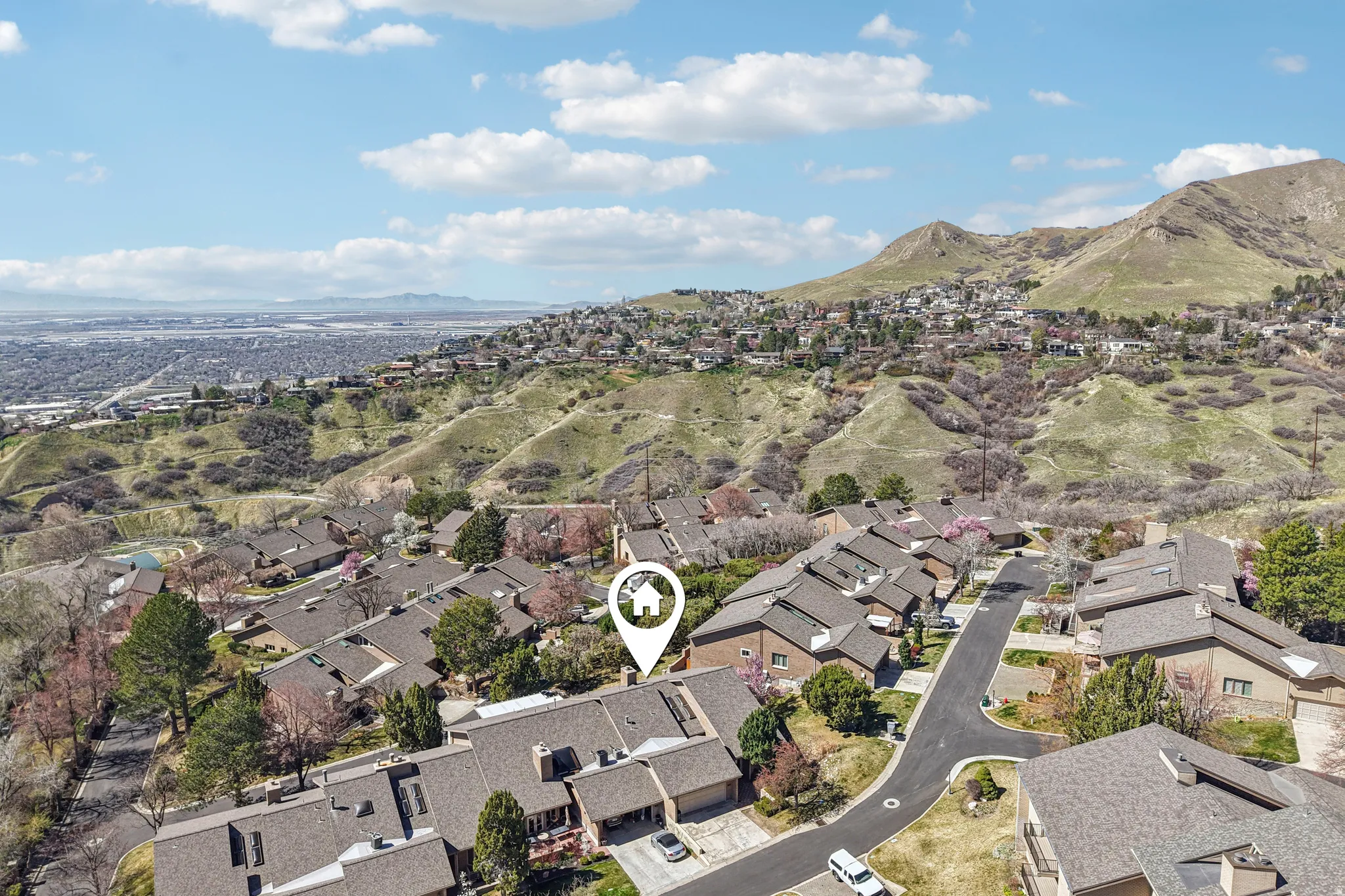 Aerial view of residential area with a mountain backdrop