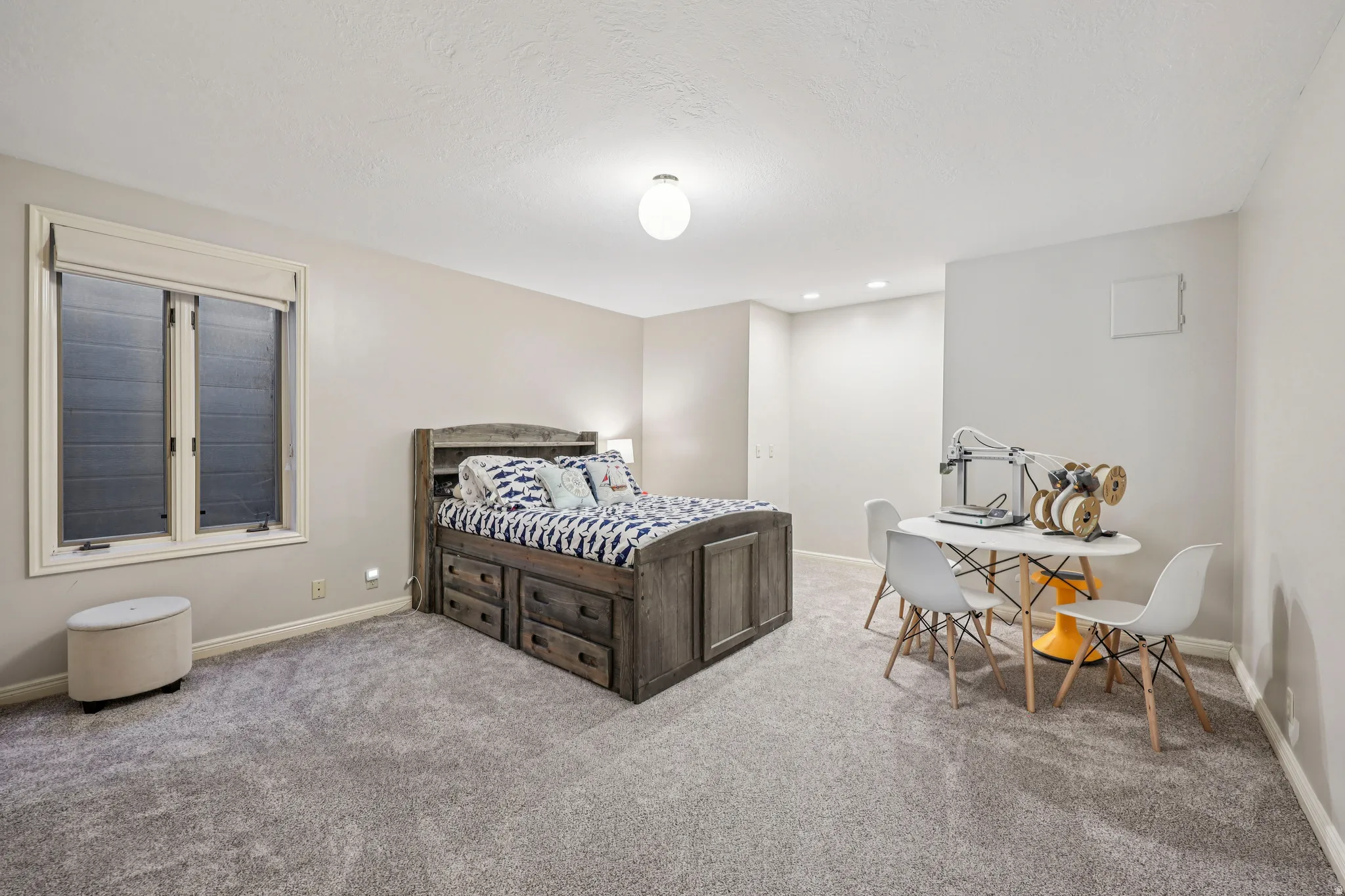 Bedroom with light carpet and recessed lighting