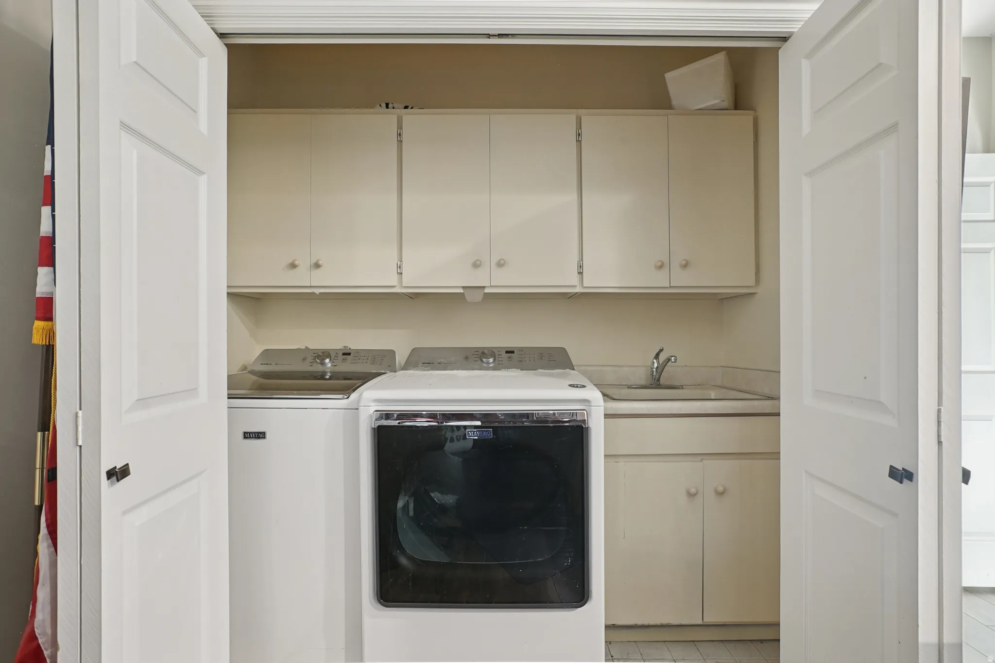 Laundry room with cabinet space and washing machine and dryer