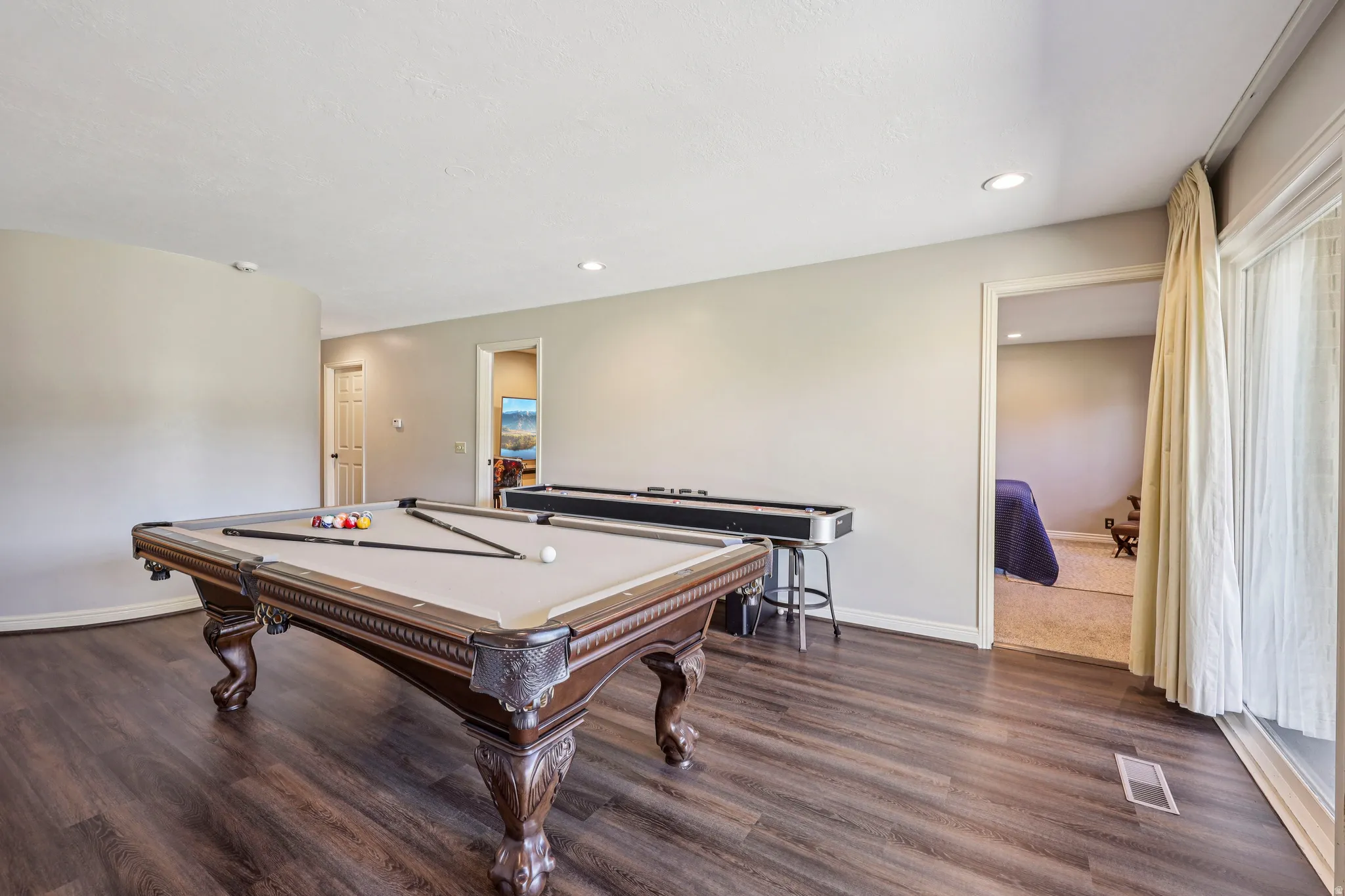 Playroom with dark wood finished floors, pool table, and recessed lighting