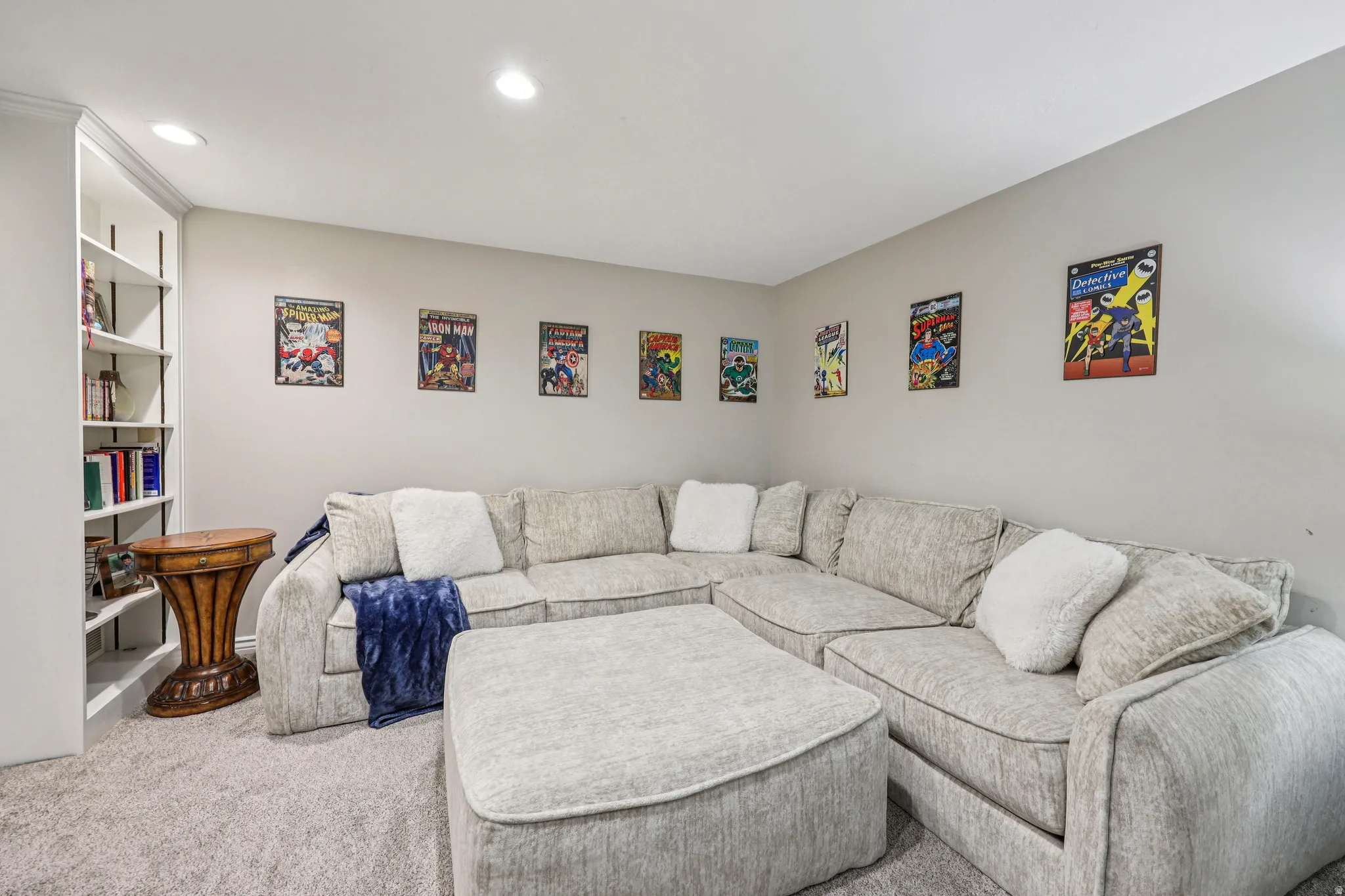 Carpeted living area with recessed lighting