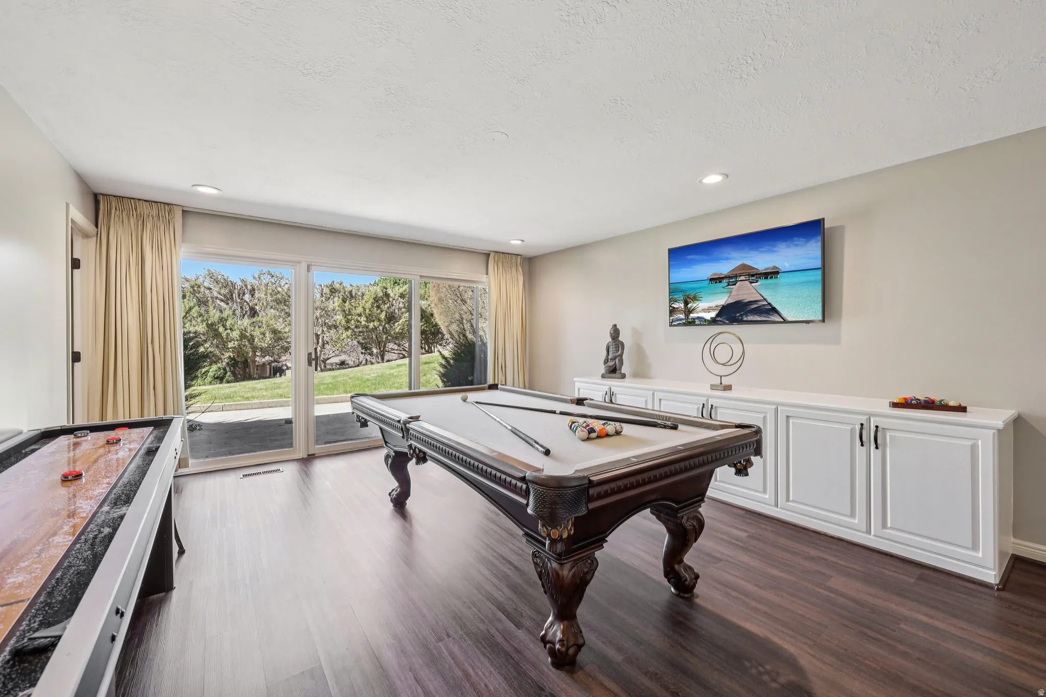 Recreation room featuring pool table, dark wood finished floors, recessed lighting, and a textured ceiling