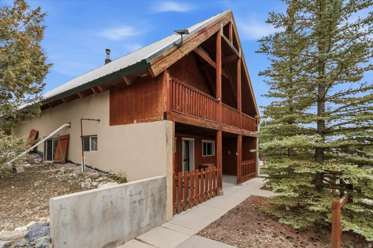View of home's exterior with a metal roof and stucco siding