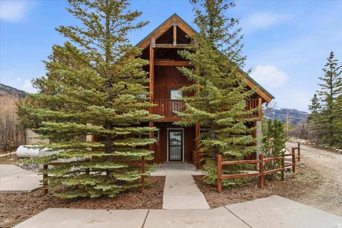 View of front facade featuring a mountain view and a balcony