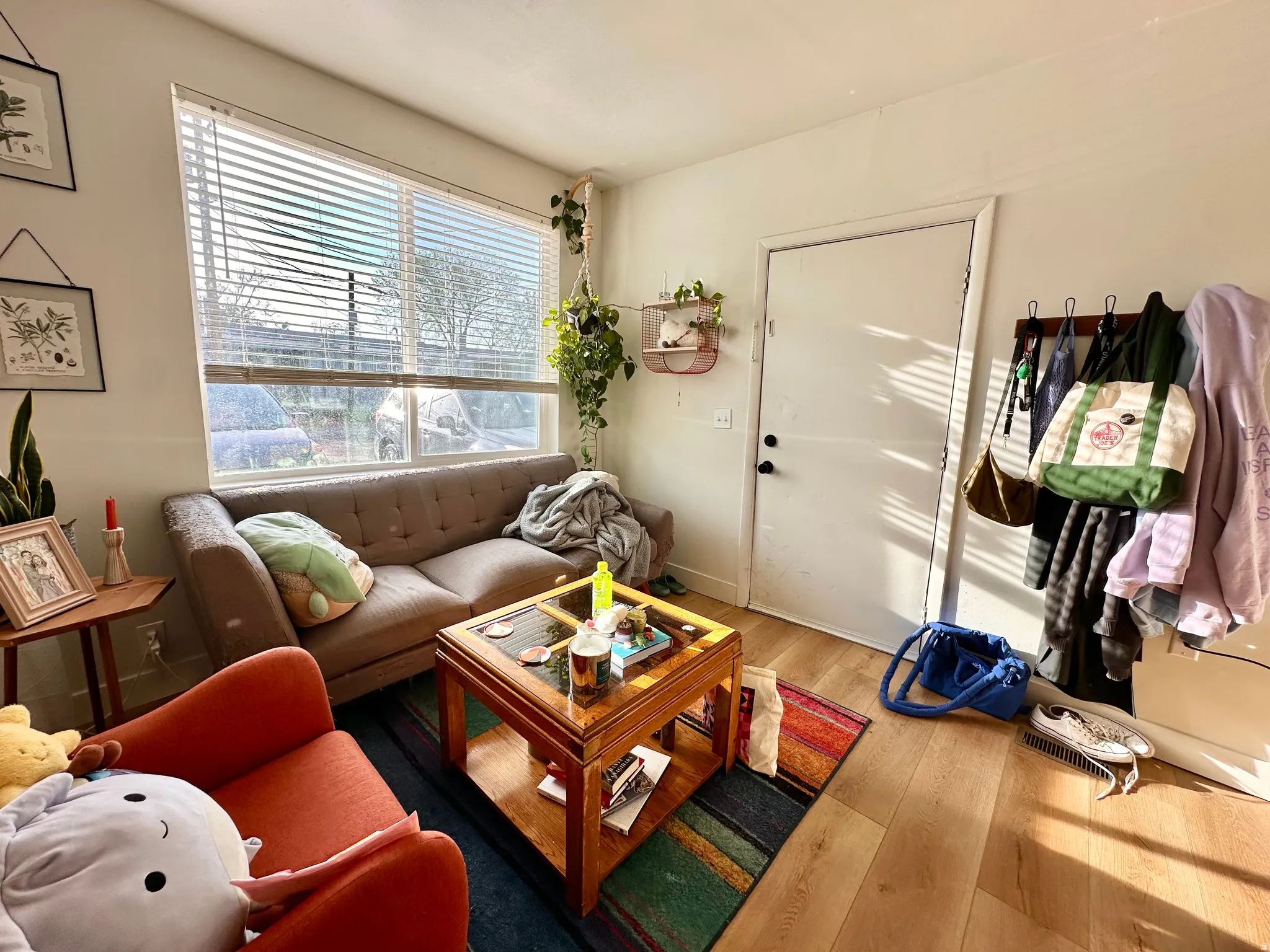 Living room with light wood-style flooring and baseboards