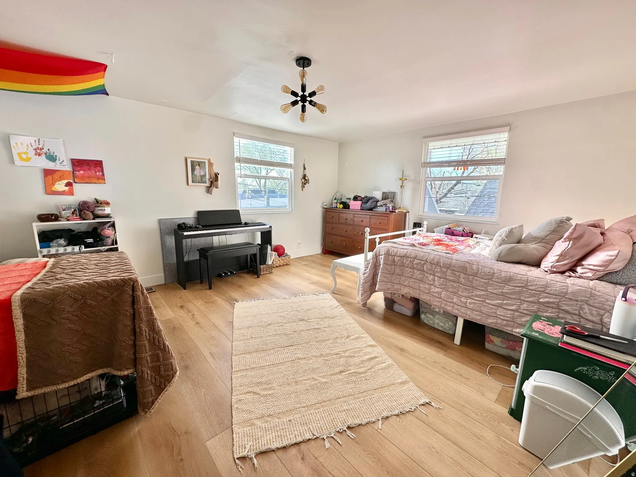 Bedroom featuring light wood-style flooring and a ceiling fan