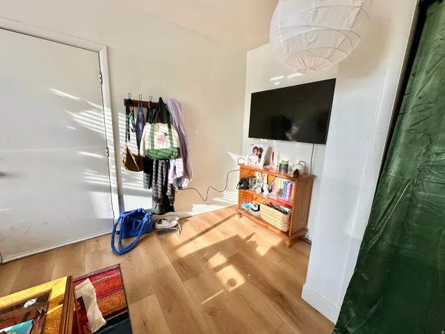 Bedroom featuring light wood finished floors and baseboards