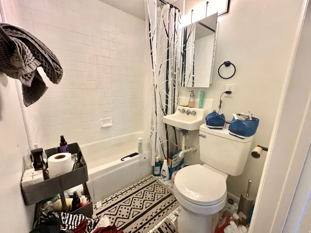 Bathroom with toilet and shower / bath combo