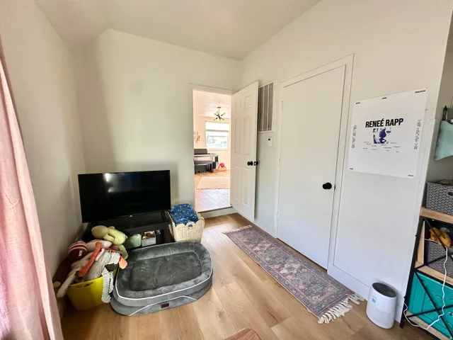 Sitting room with light wood-style floors