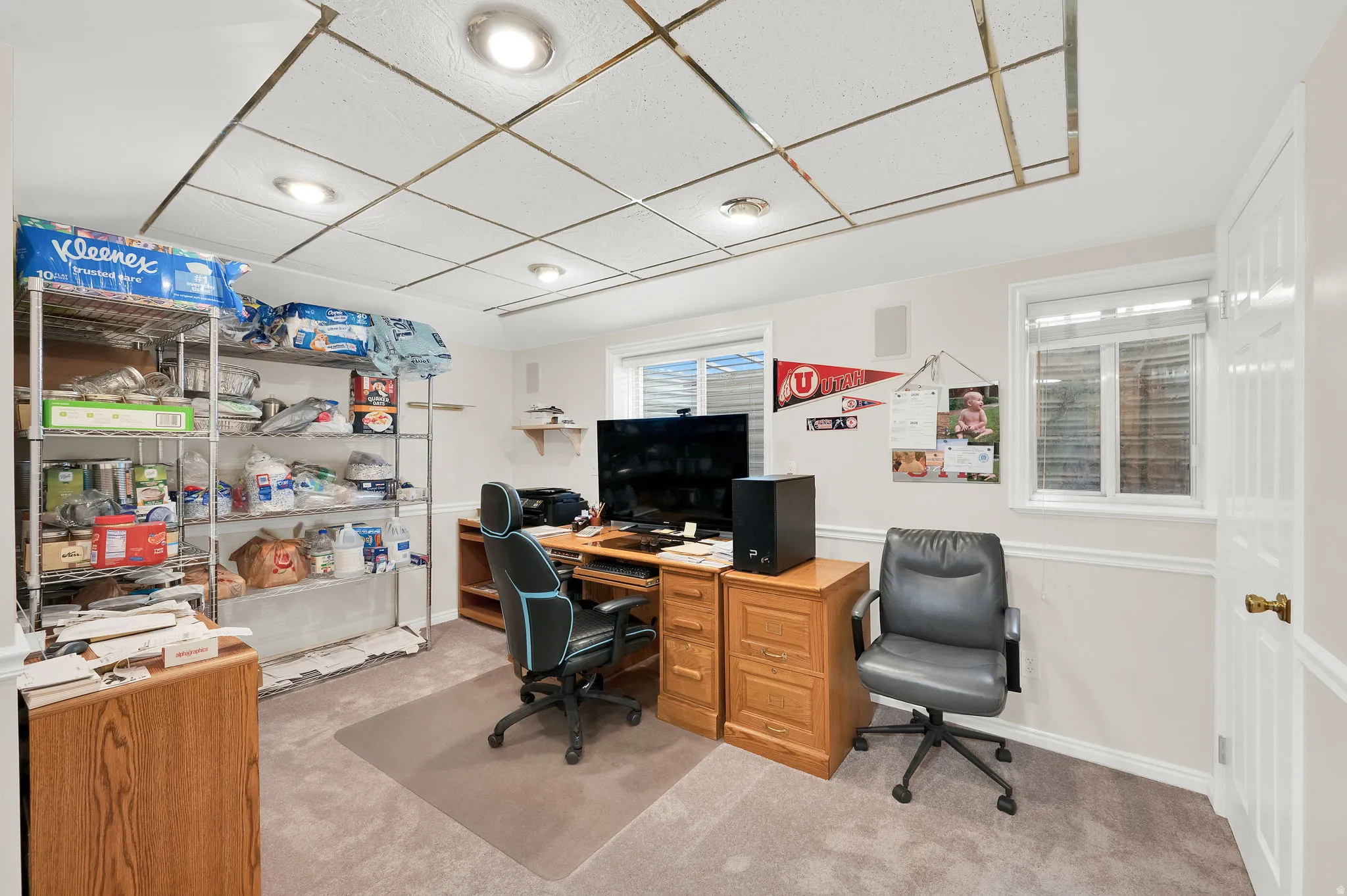 Home office featuring light colored carpet and a drop ceiling