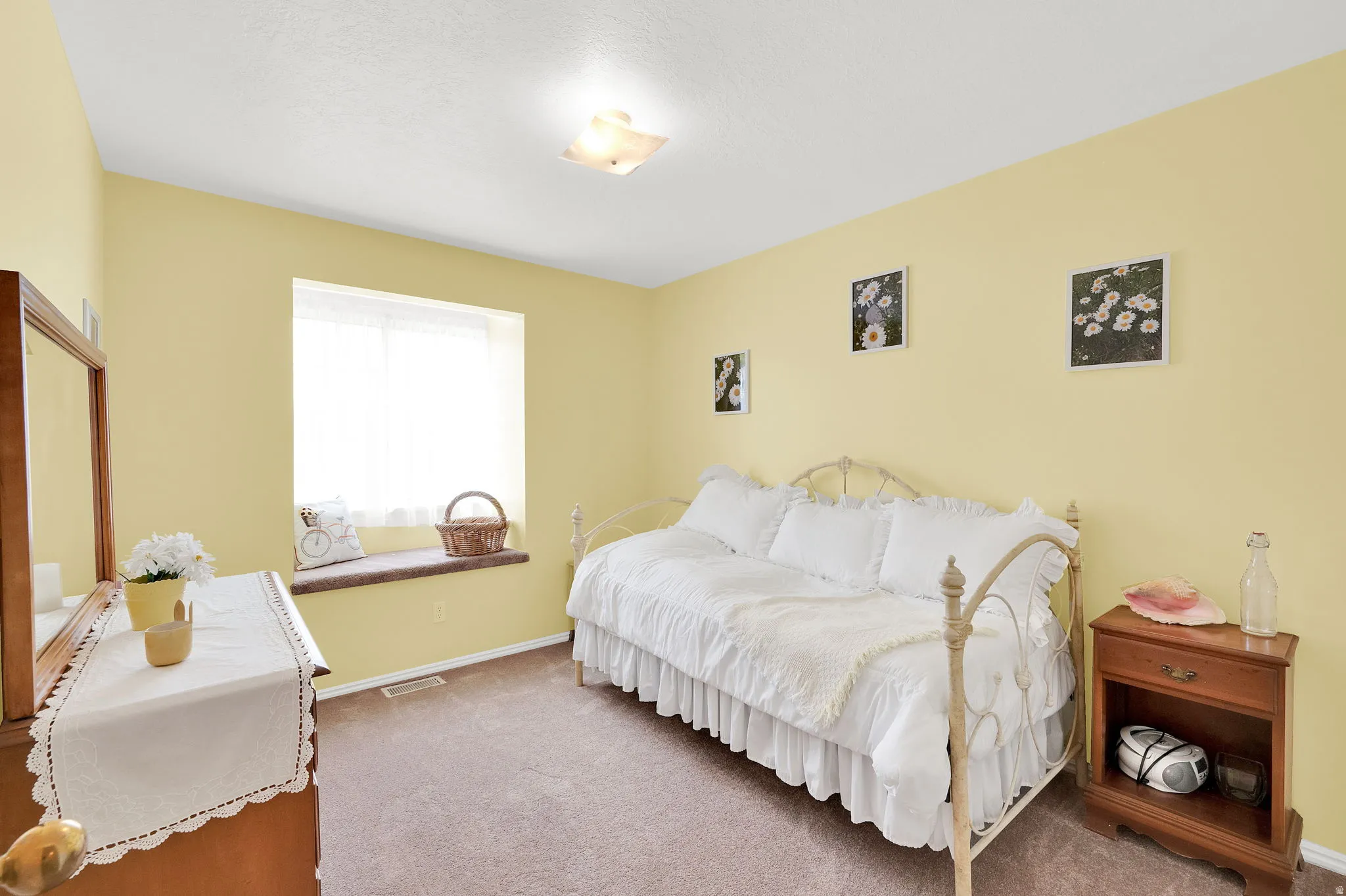 Carpeted bedroom featuring baseboards