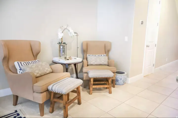 Sitting room featuring baseboards and tile patterned flooring