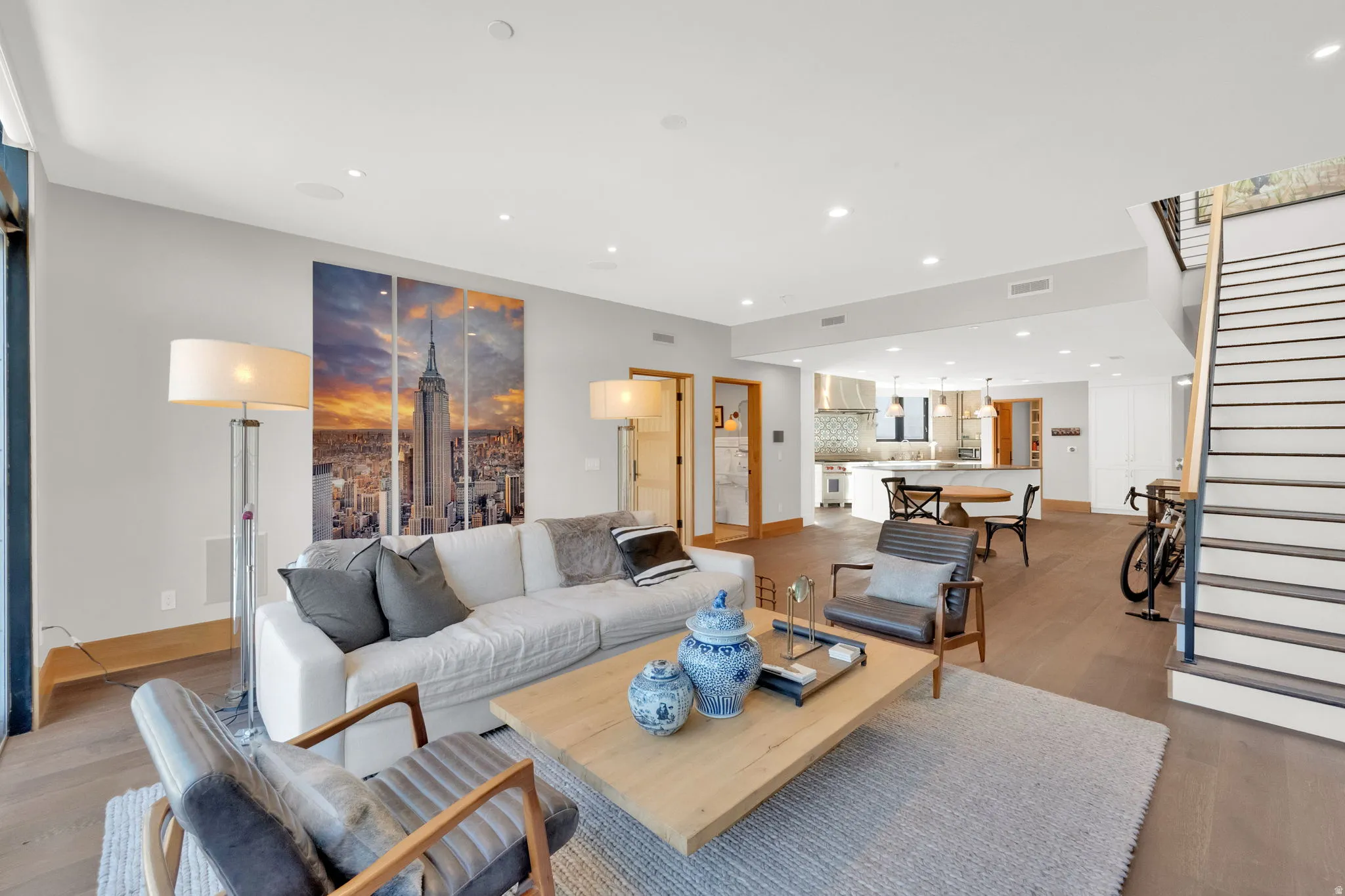 Living room featuring light wood-style flooring and recessed lighting