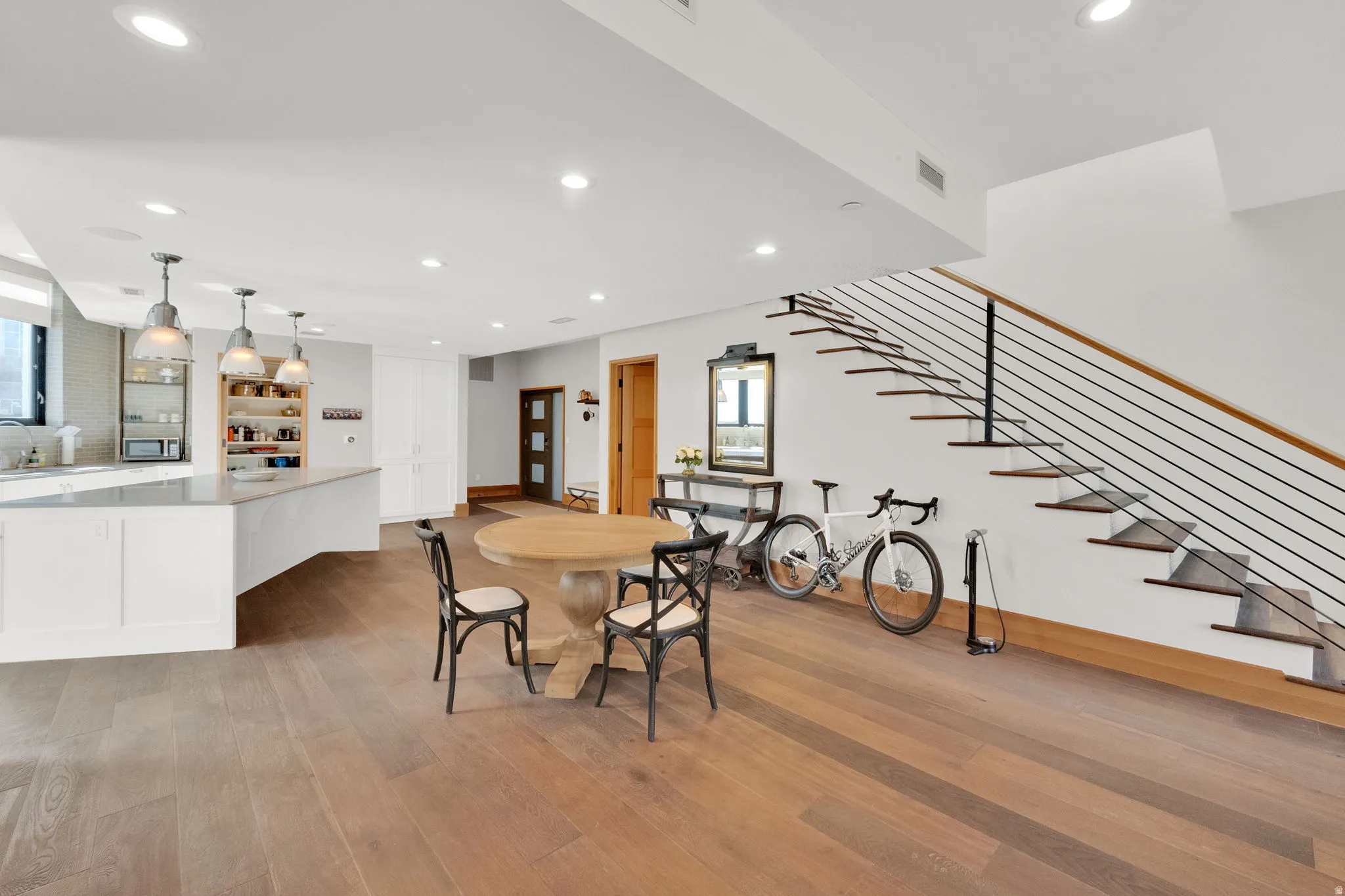 Dining space featuring recessed lighting and light wood finished floors