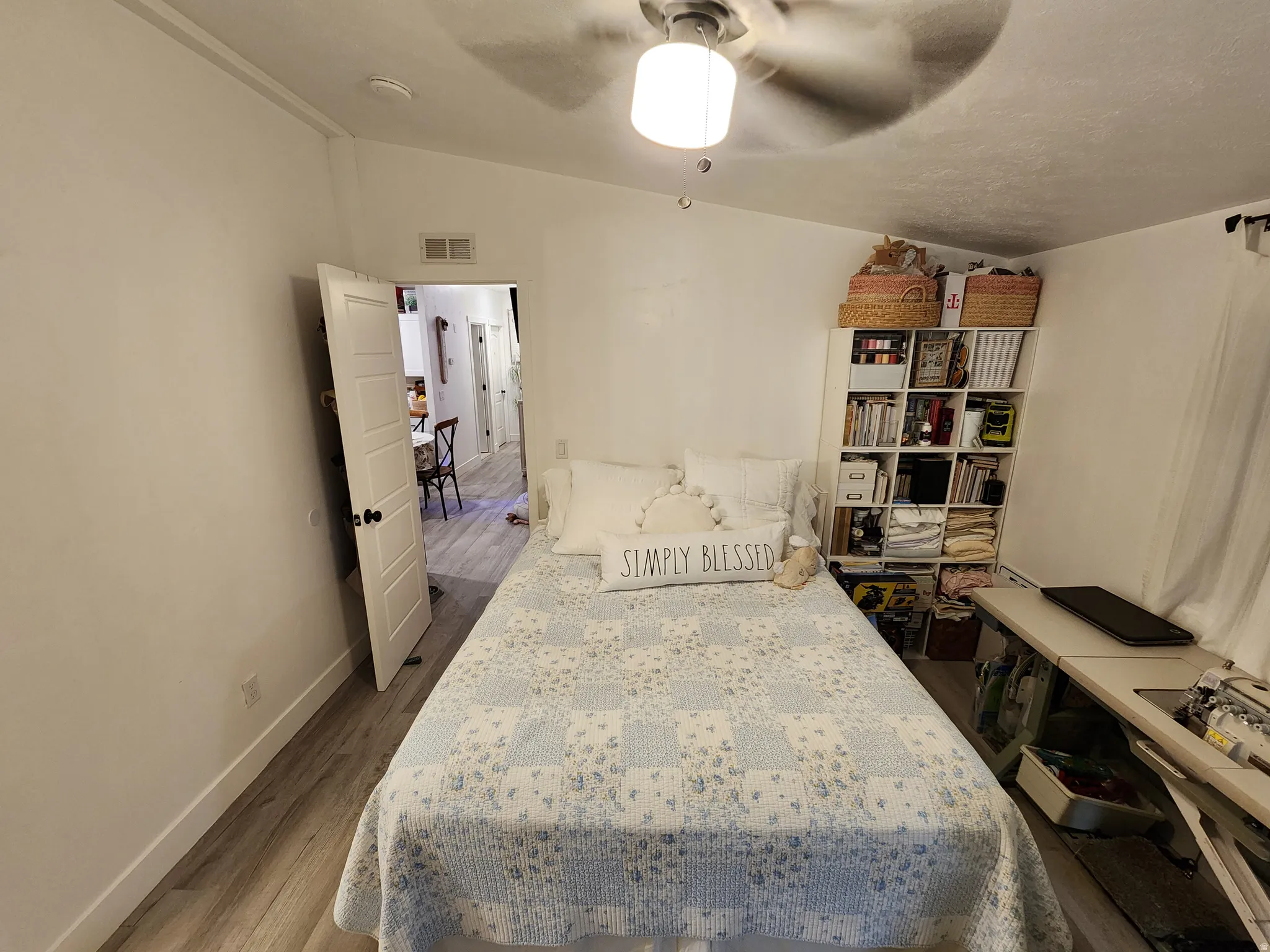 Bedroom featuring lofted ceiling, dark wood-type flooring, and ceiling fan