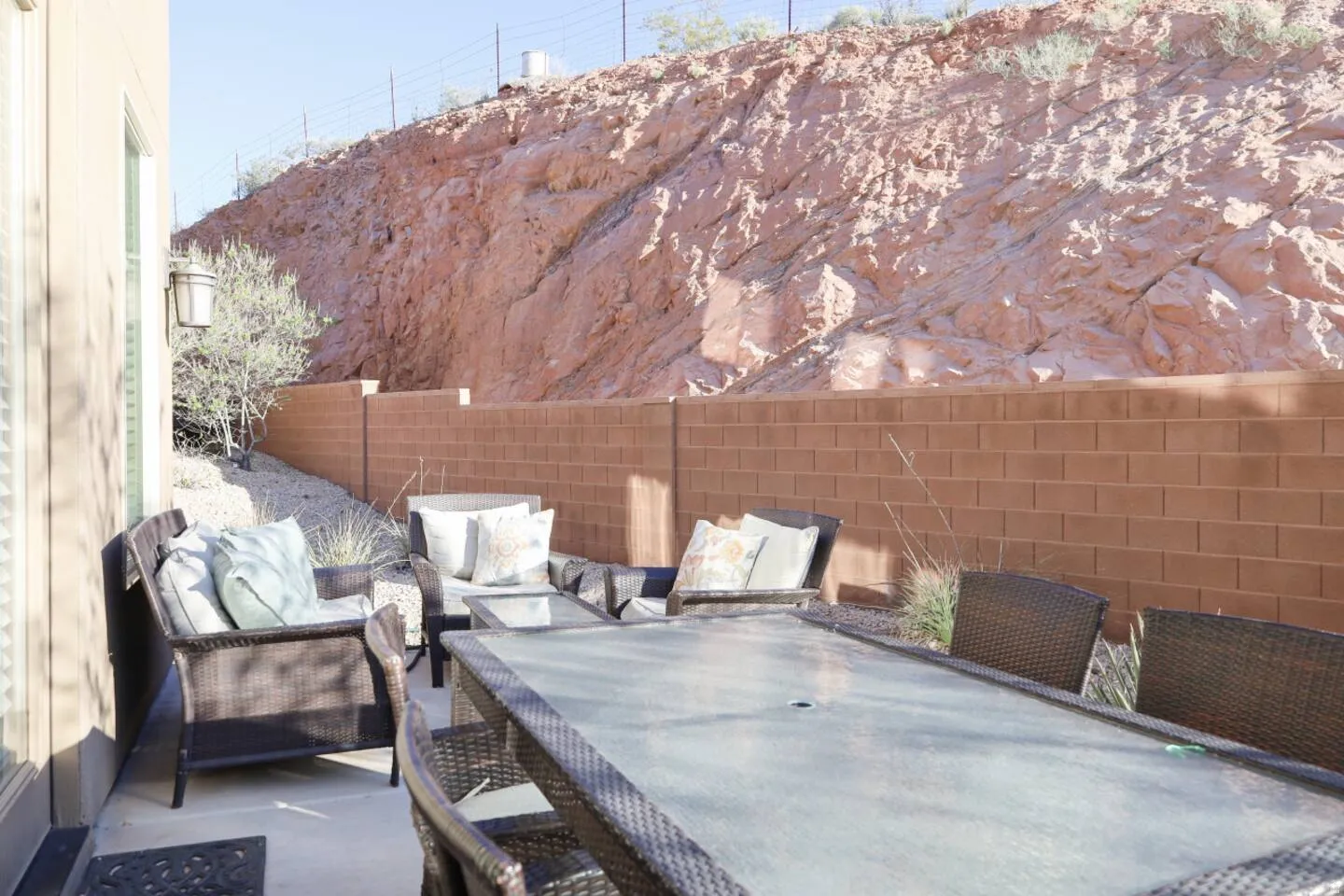 Fenced backyard with outdoor dining space and a patio area