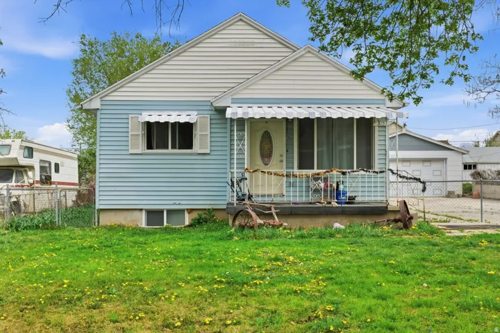 Bungalow featuring a garage