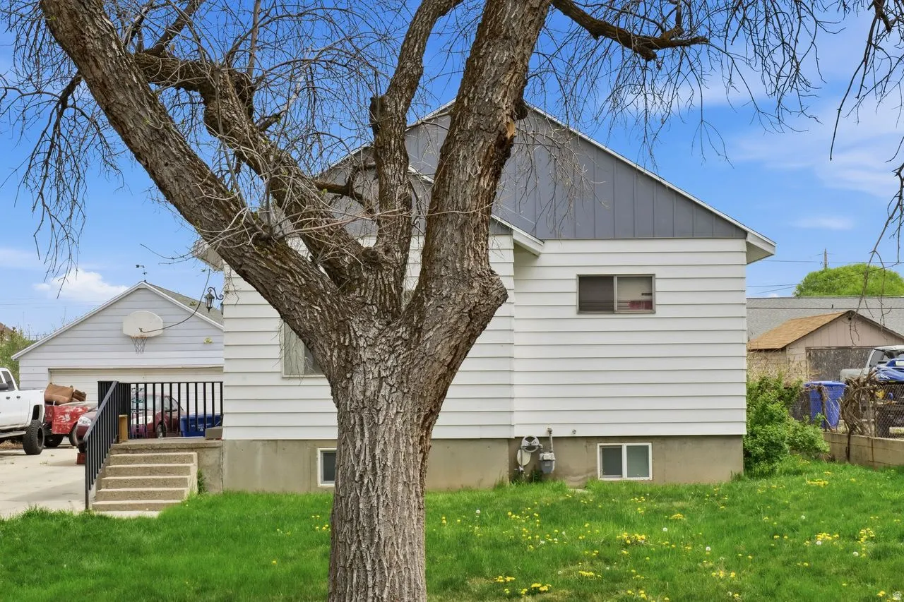 View of side of home featuring a yard and board and batten siding