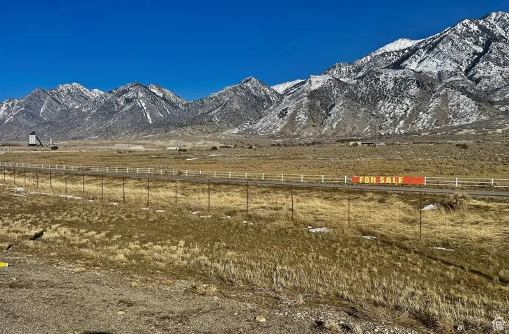 View of mountain backdrop with rural landscape