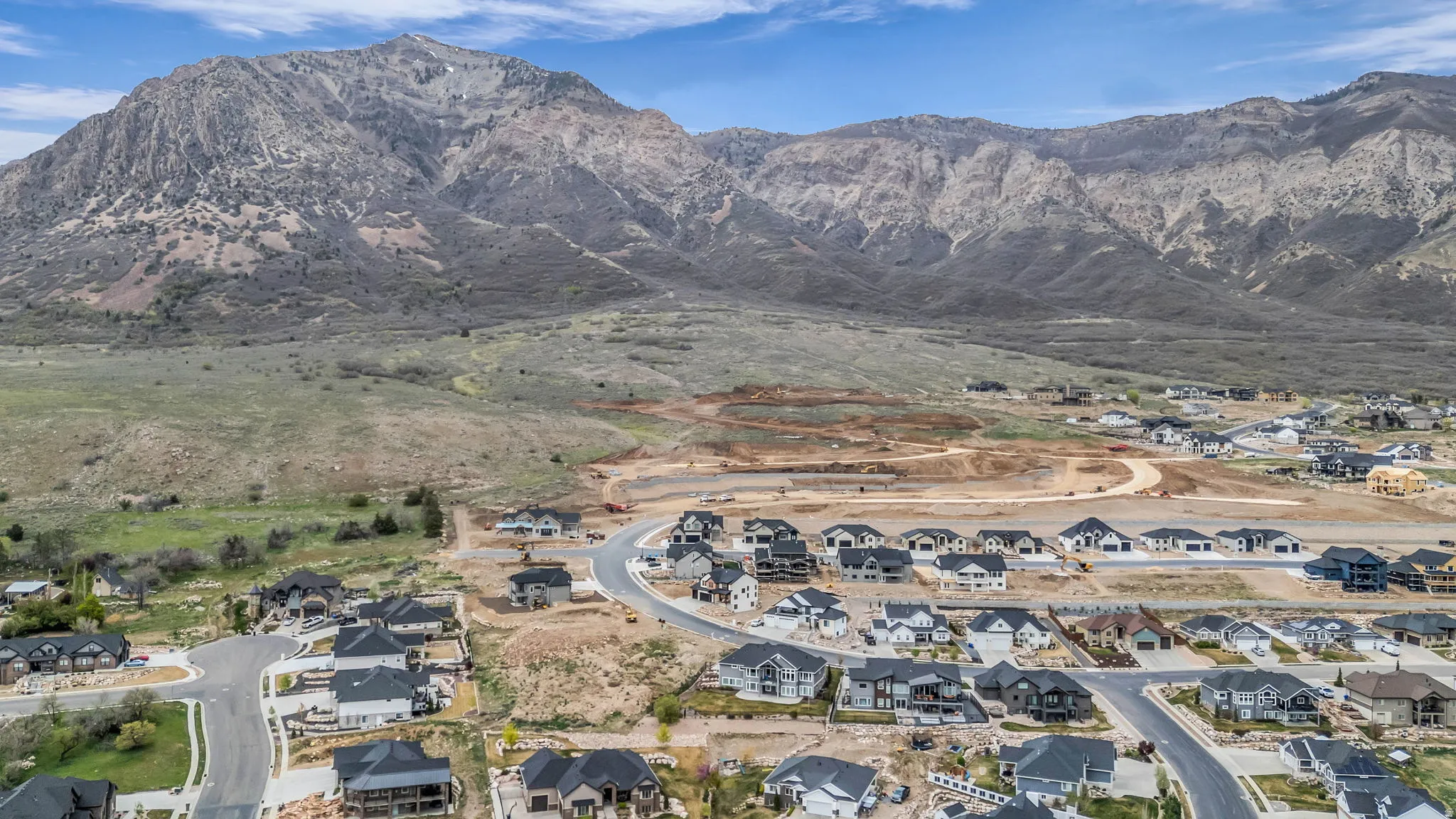 Aerial perspective of suburban area featuring a mountain backdrop