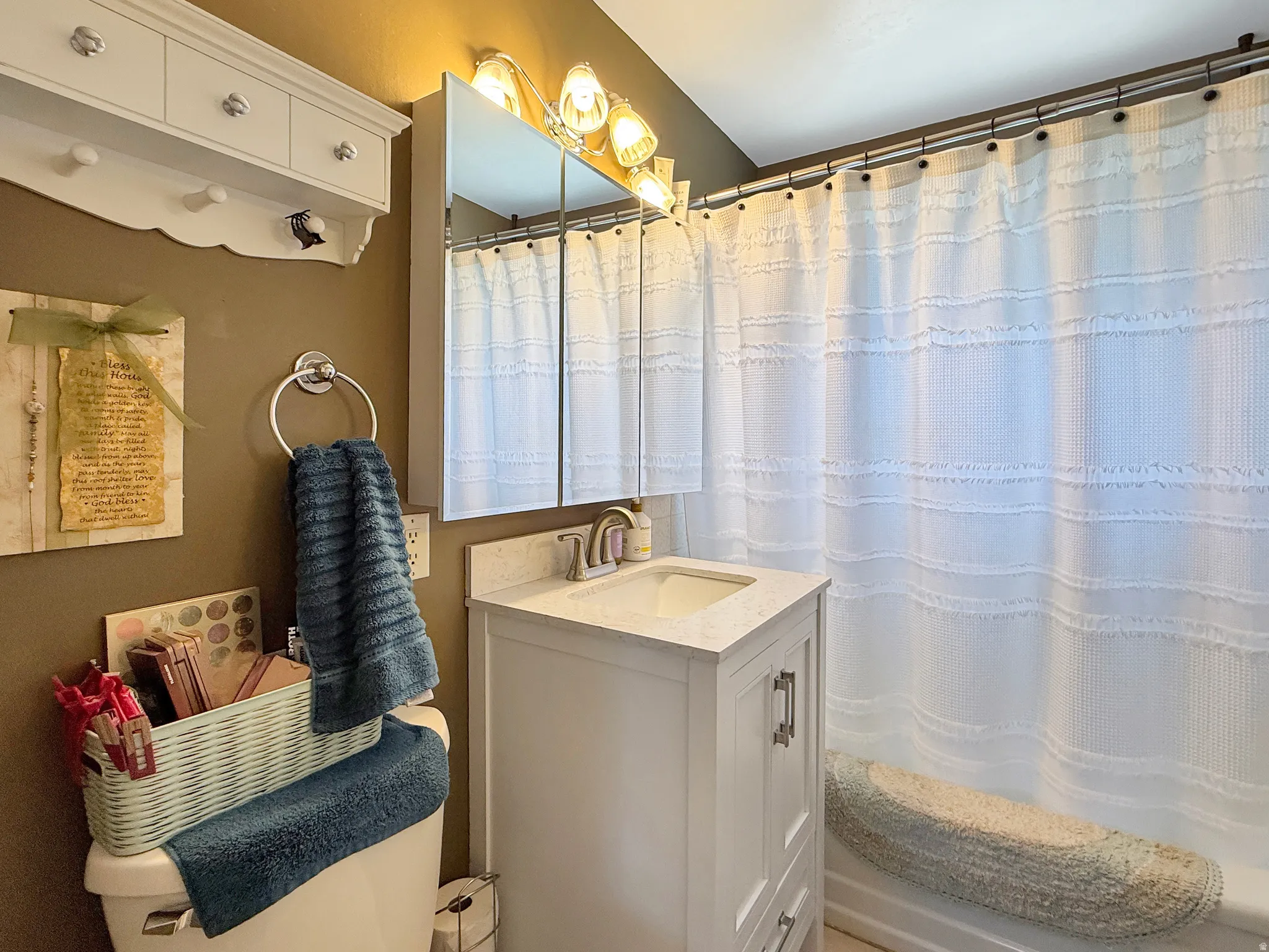 Bathroom featuring vanity and a shower with curtain