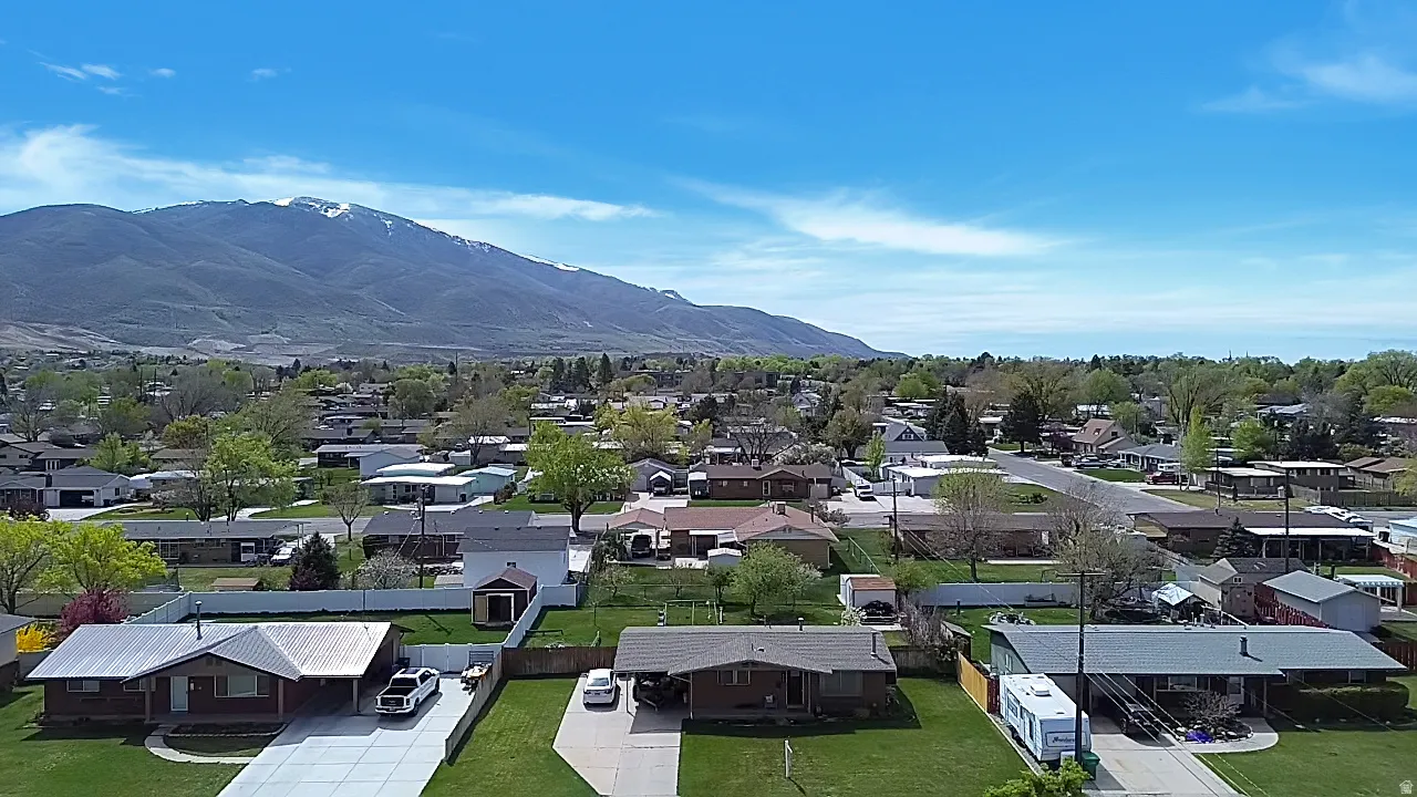 Aerial view of residential area featuring mountains