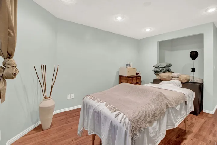 Bedroom featuring light wood finished floors and recessed lighting