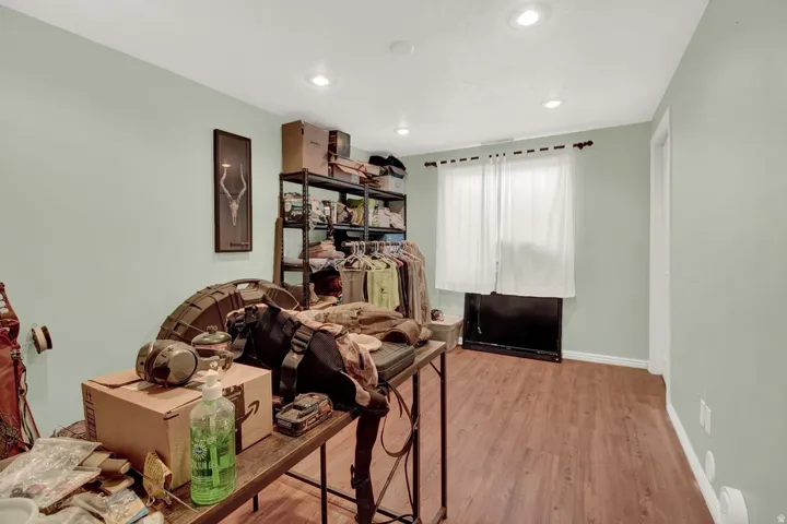 Office featuring light wood-style flooring and recessed lighting