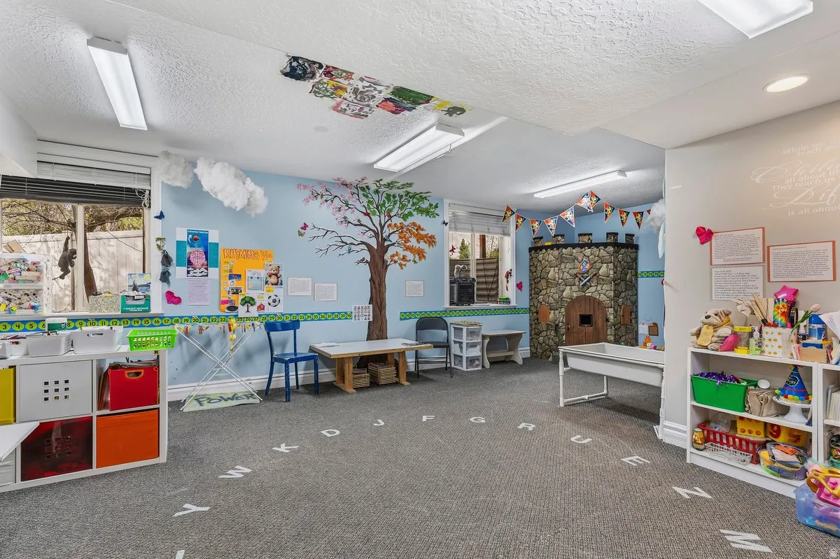 Rec room with a textured ceiling