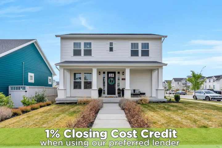 Traditional home featuring covered porch