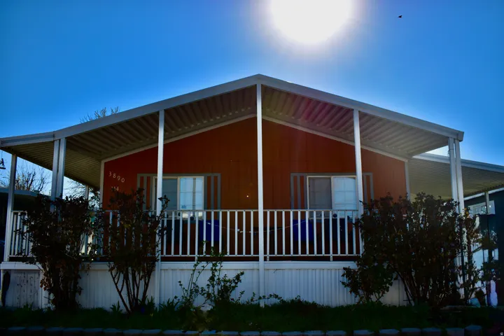 View of property exterior featuring covered porch