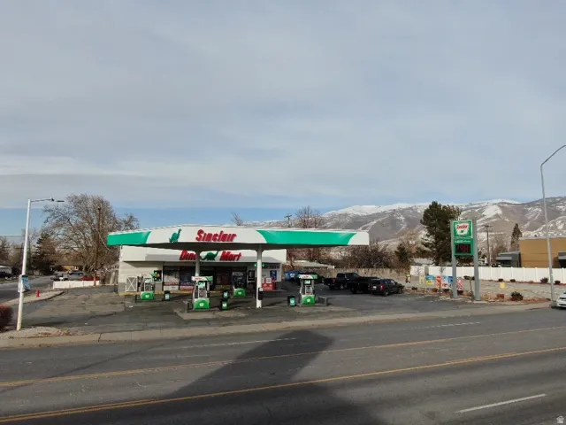 View of commercial location featuring uncovered parking and a mountain view