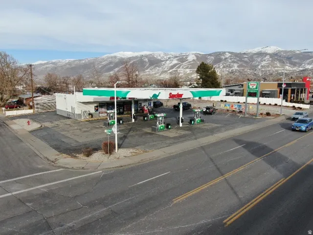 View of commercial property featuring a mountain view