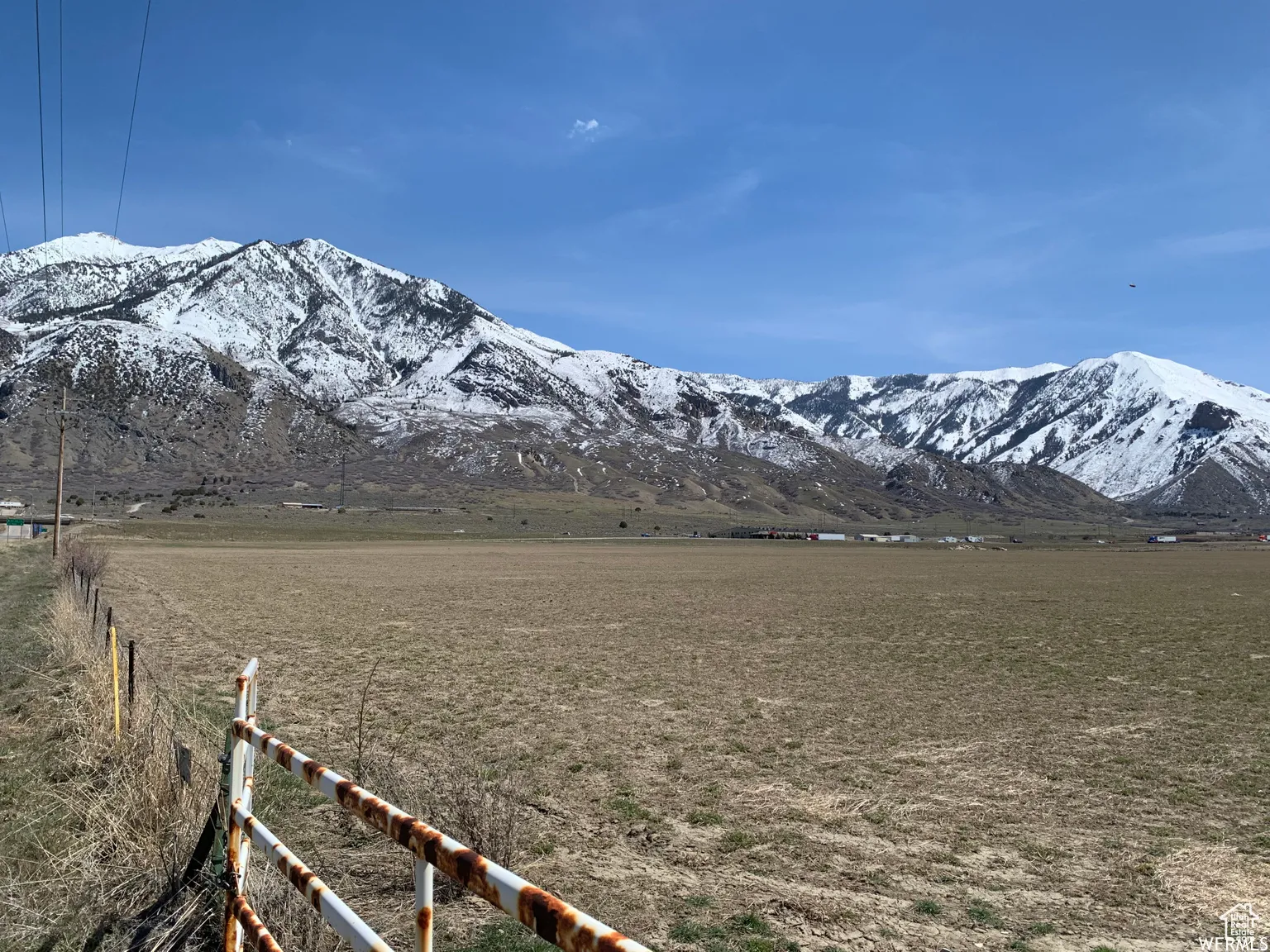 View of mountain backdrop featuring rural landscape
