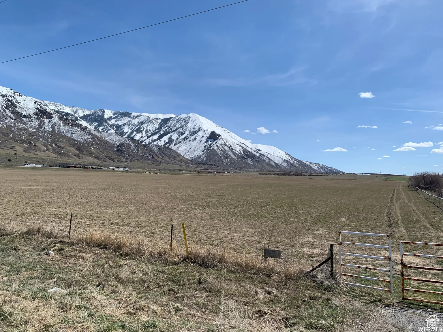 View of mountain background featuring rural landscape