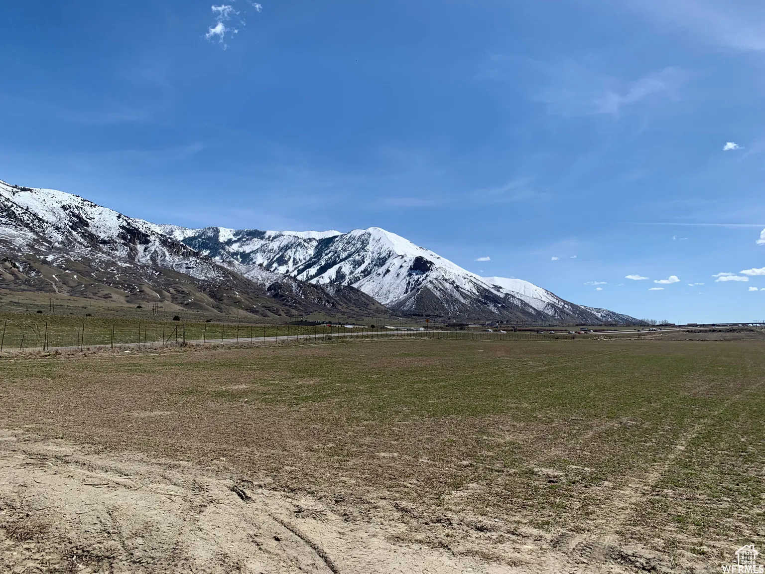 View of mountain background featuring rural landscape