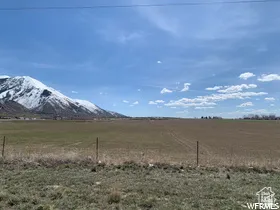 View of mountain backdrop featuring rural landscape
