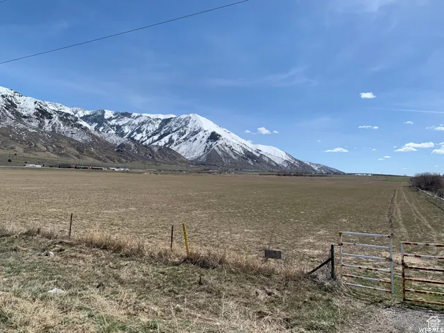 View of mountain background featuring rural landscape