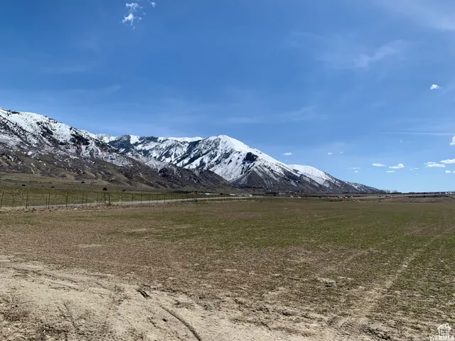 View of mountain background featuring rural landscape