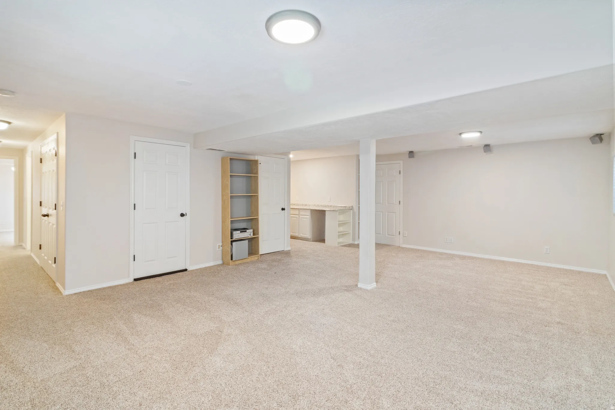 Finished below grade area with light colored carpet