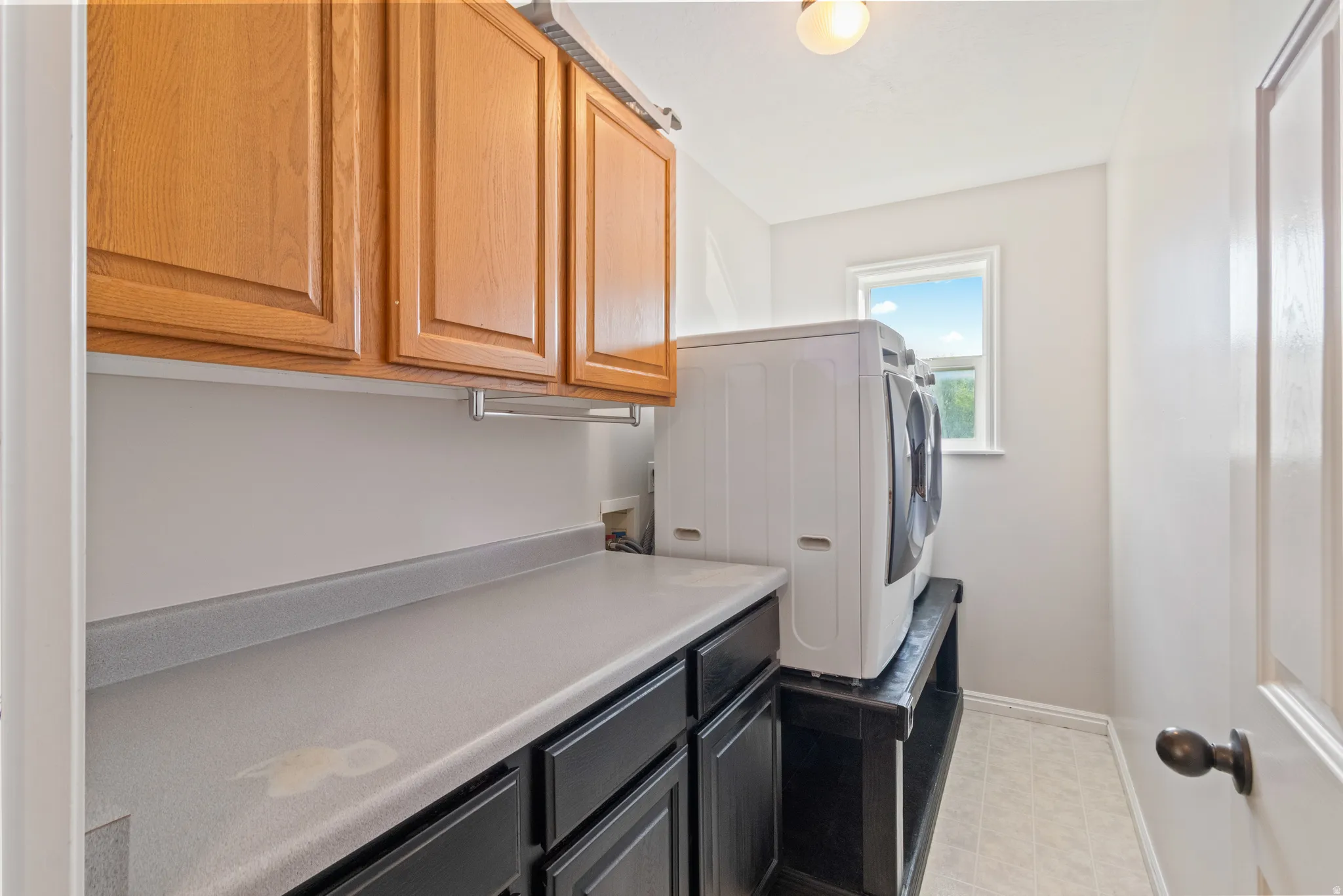 Laundry area with cabinet space and washer hookup