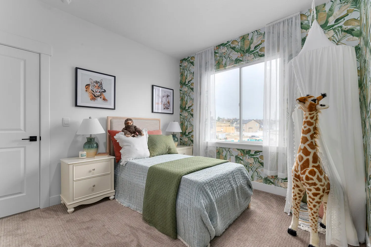 Bedroom featuring light carpet and wallpapered walls