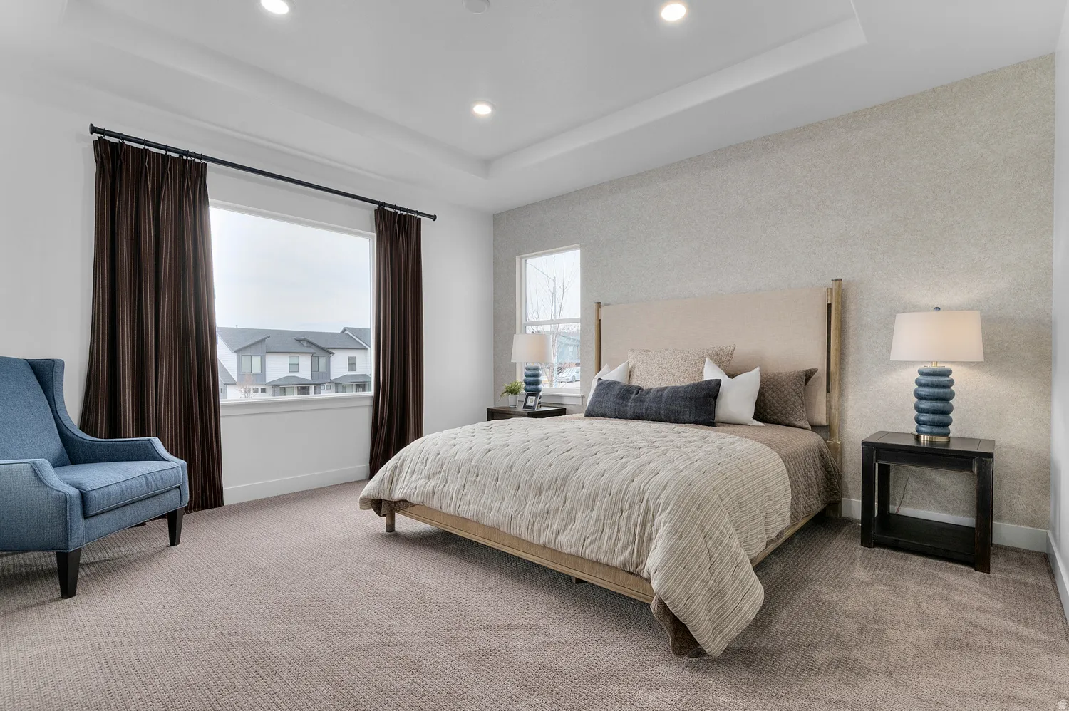Bedroom featuring recessed lighting, carpet, and a raised ceiling