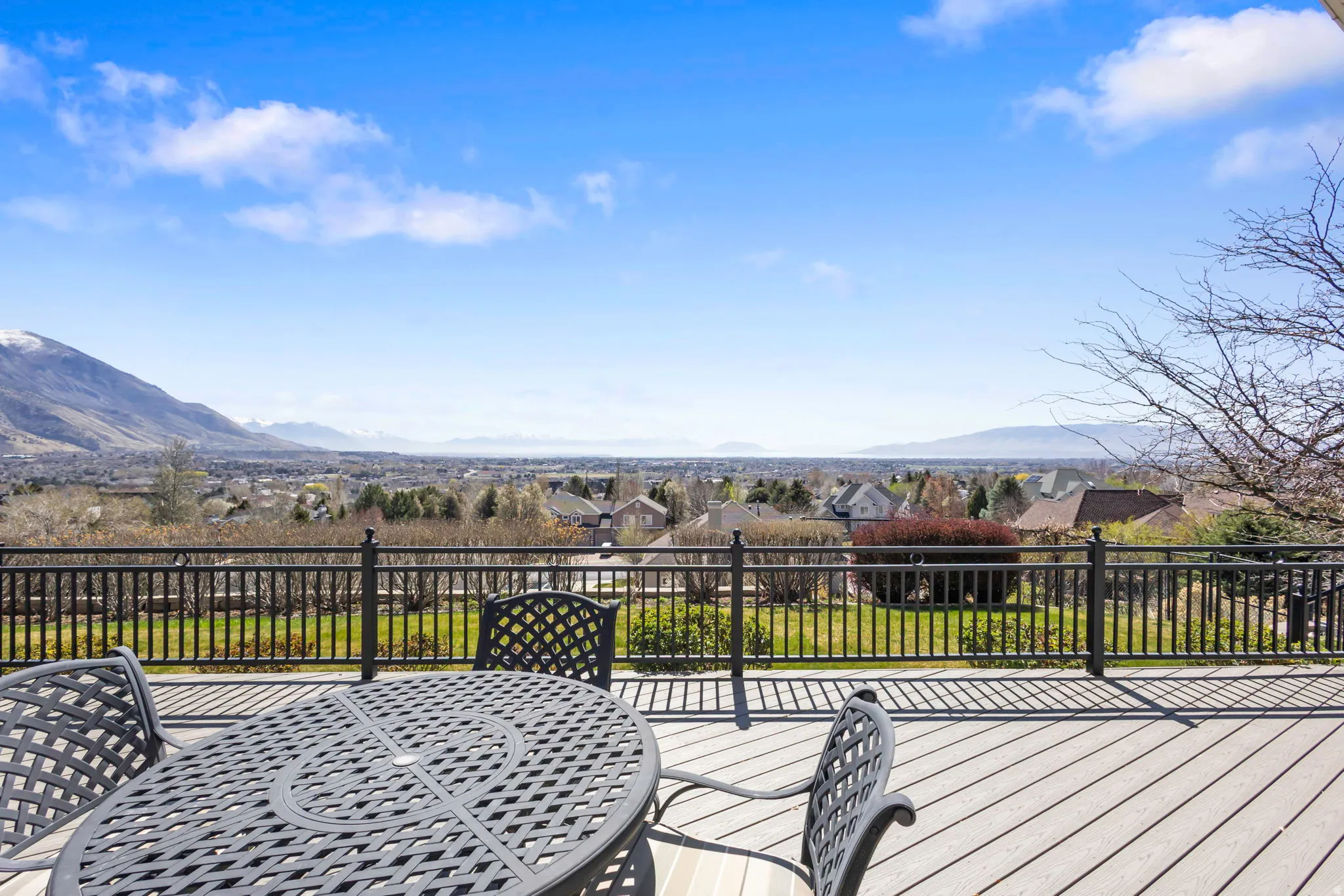 Deck featuring a residential view, a mountain view, and outdoor dining area