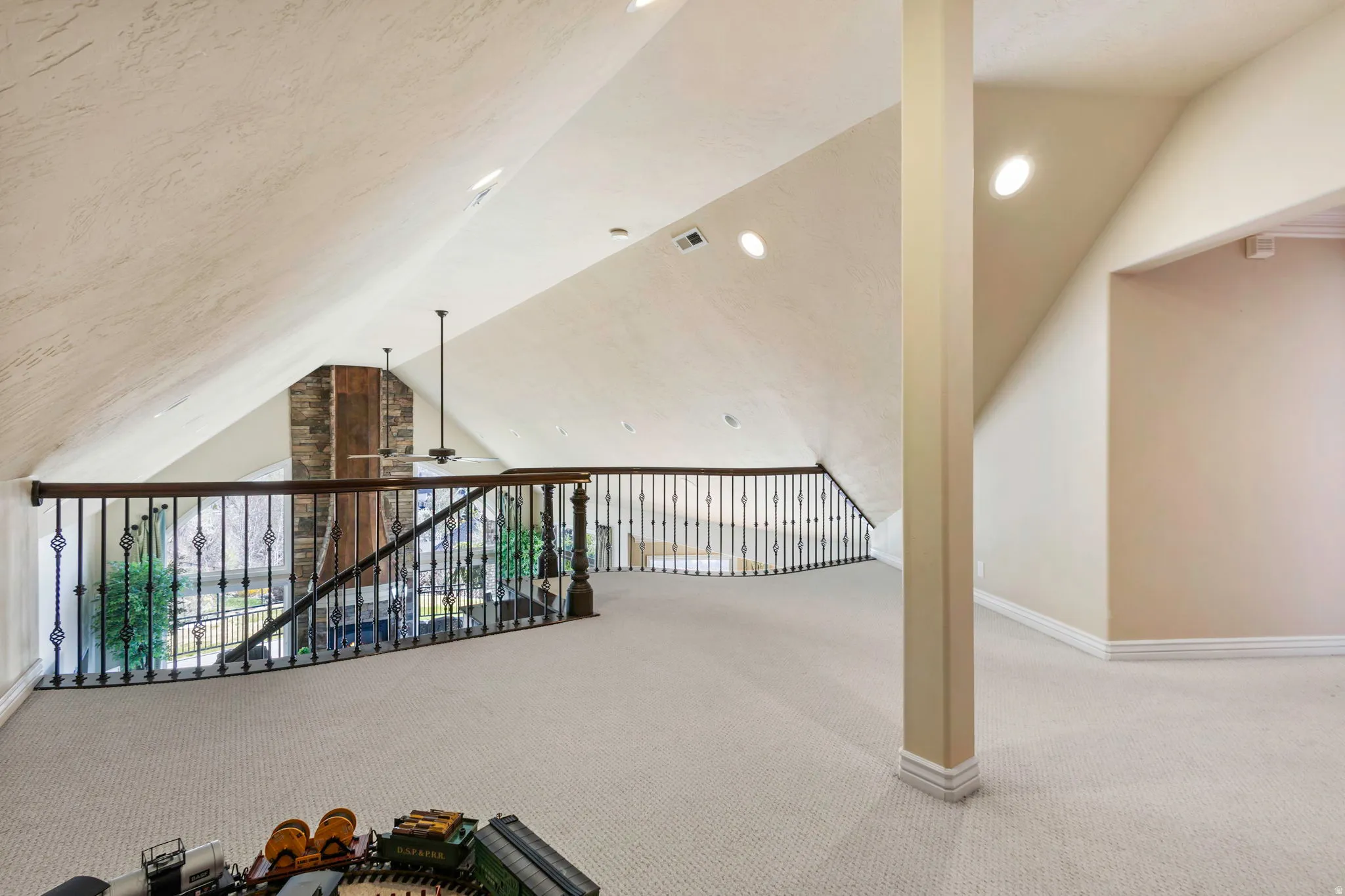 Bonus room featuring light carpet, ceiling fan, and recessed lighting