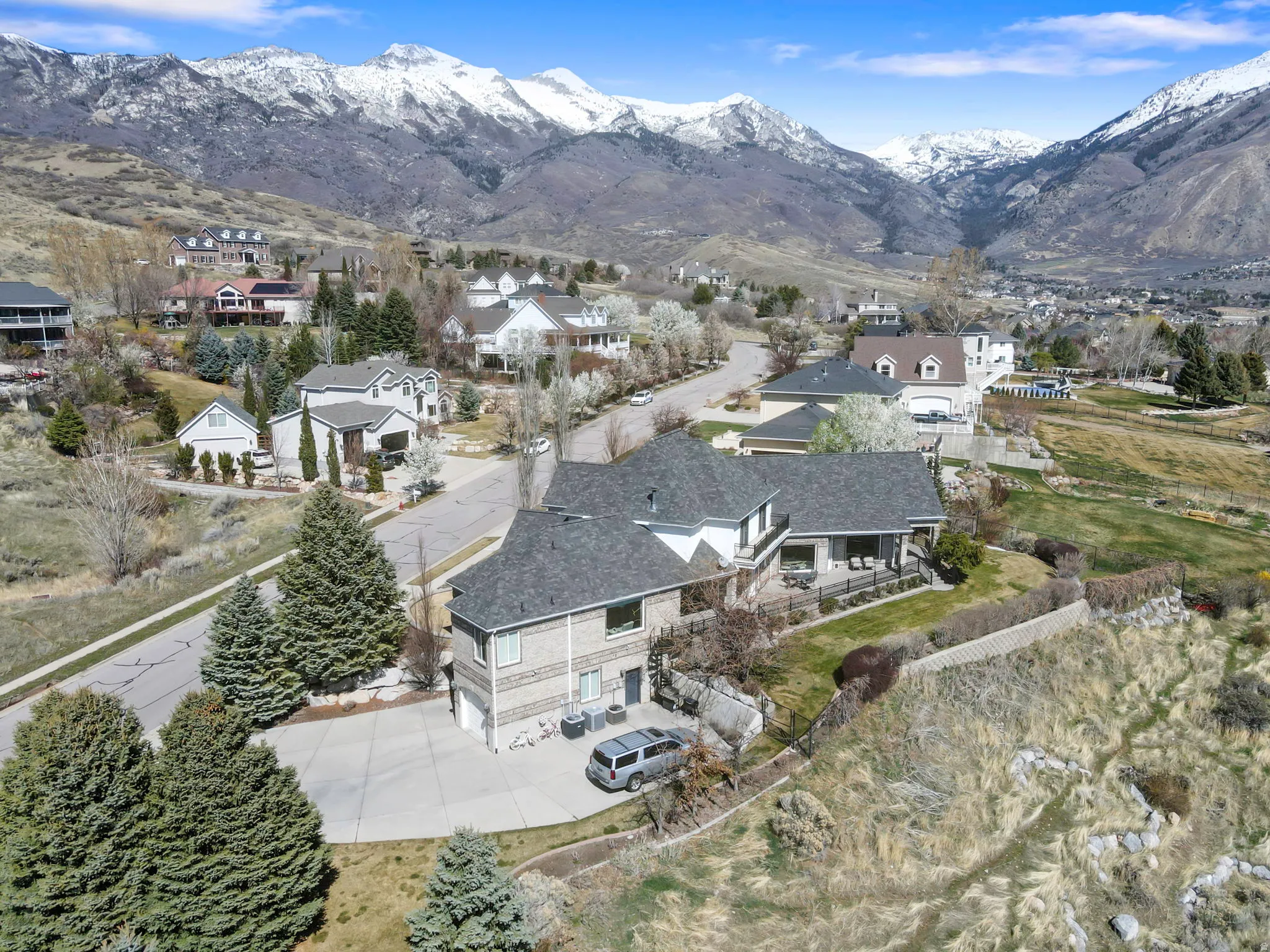 Aerial view of residential area featuring mountains