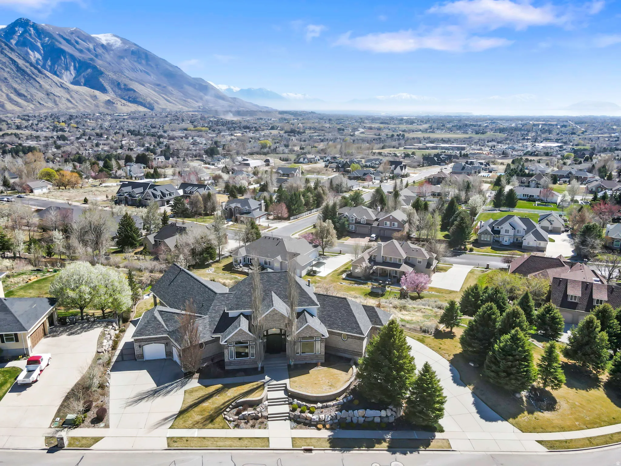 Aerial perspective of suburban area with a mountainous background
