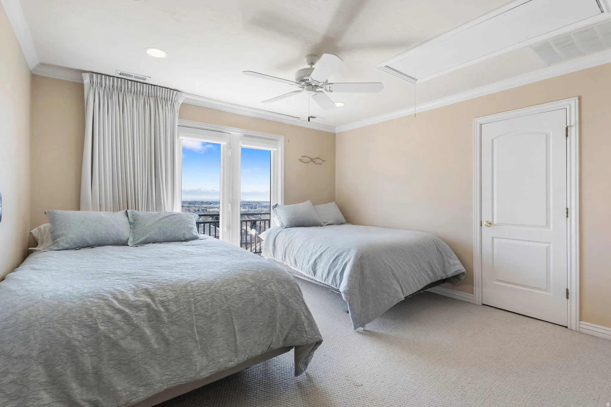 Carpeted bedroom featuring crown molding, access to exterior, and ceiling fan